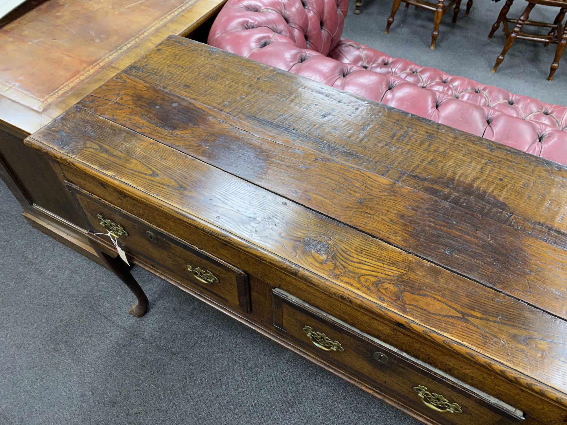 An 18th century banded oak cabriole leg low dresser, length 176cm, depth 51cm, height 90cm